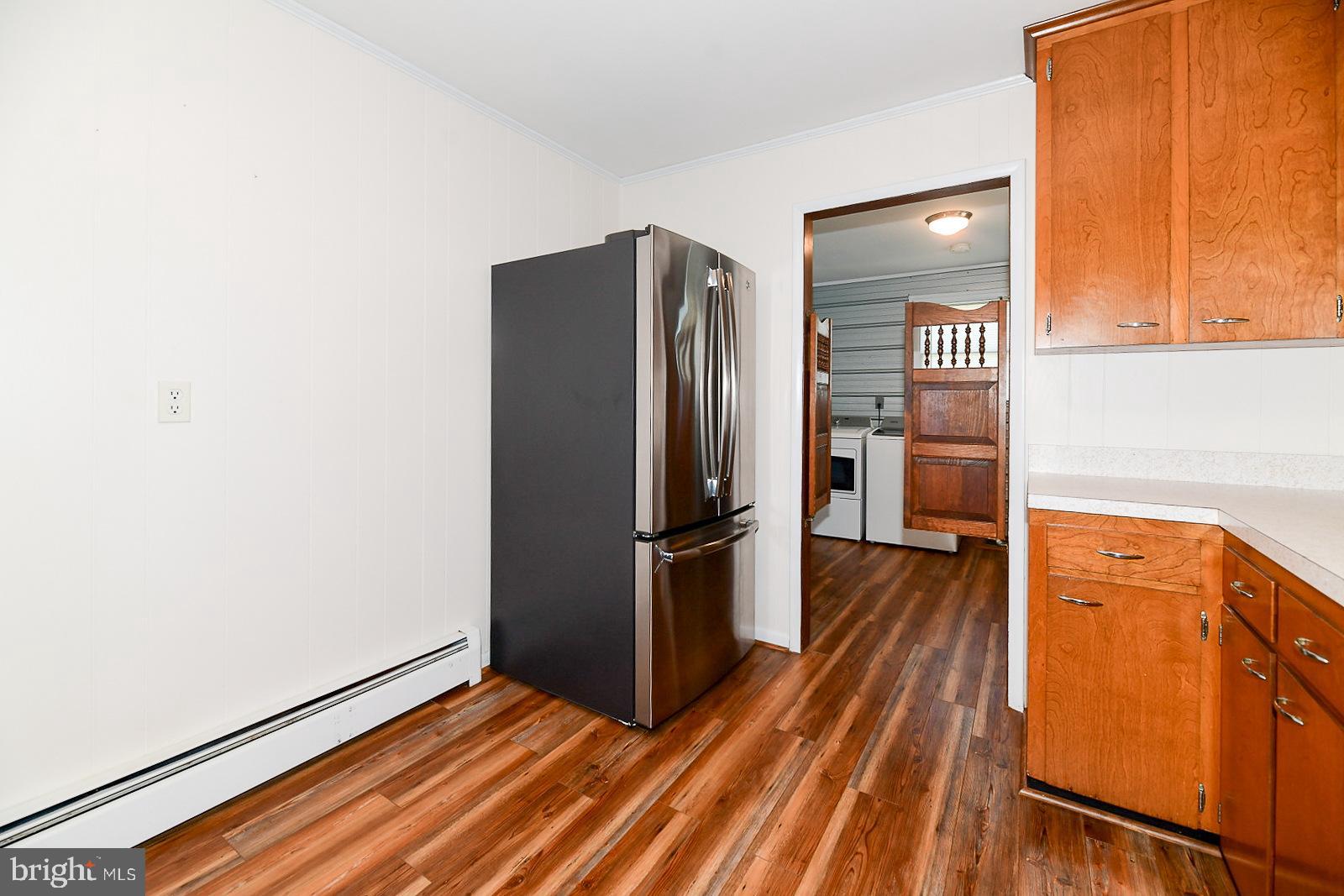 40480 Parsons Mill Road Leonardtown, MD 20650 - Photo 14 of 48 a kitchen with stainless steel appliances a refrigerator and a stove