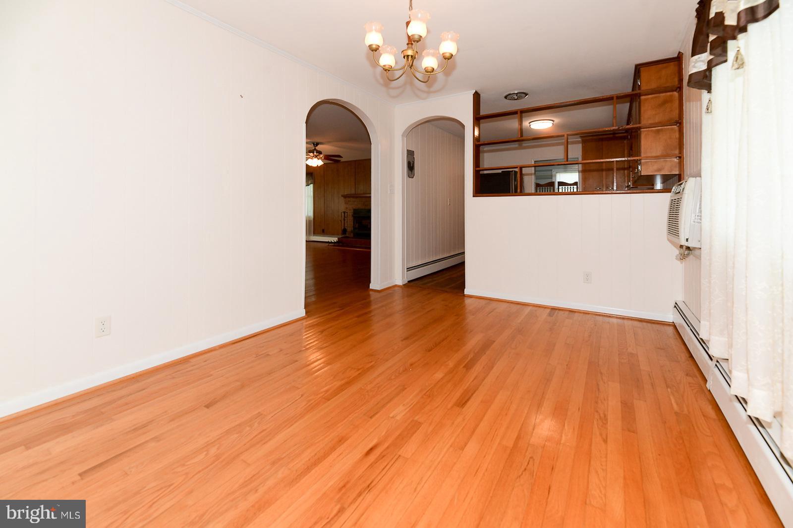 40480 Parsons Mill Road Leonardtown, MD 20650 - Photo 15 of 48 a view of a room with wooden floor and chandelier