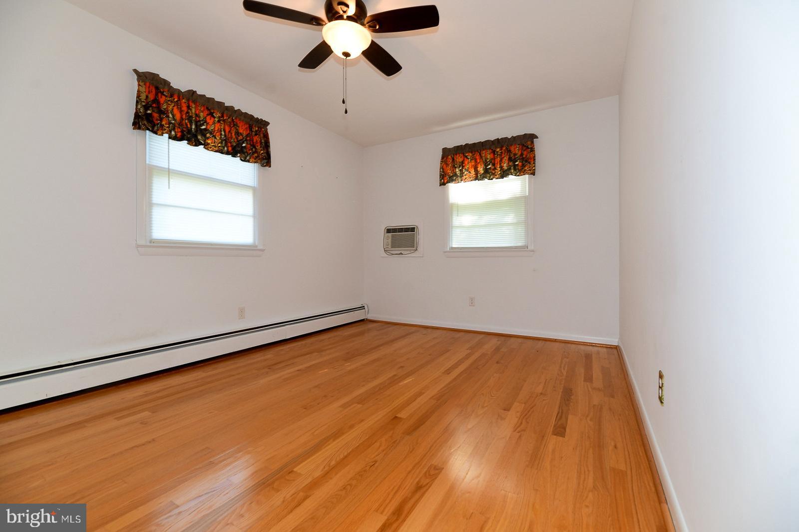 40480 Parsons Mill Road Leonardtown, MD 20650 - Photo 19 of 48 an empty room with a window and a ceiling fan