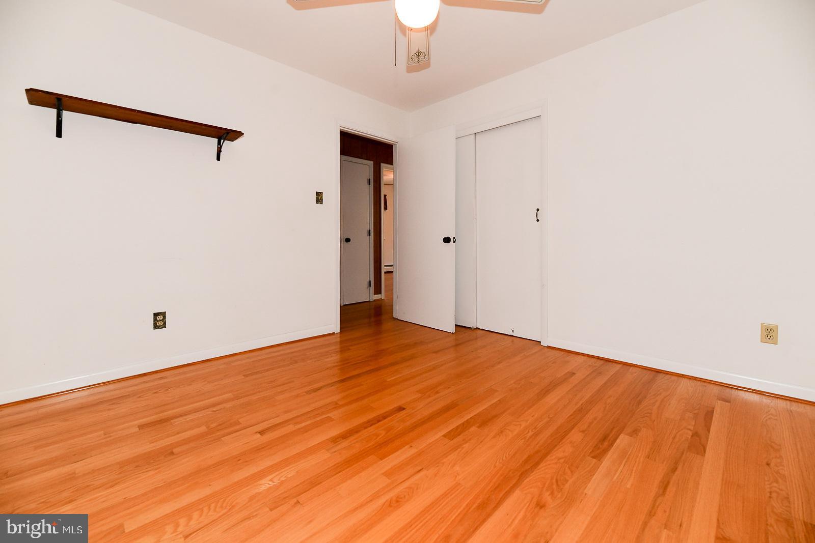 40480 Parsons Mill Road Leonardtown, MD 20650 - Photo 22 of 48 a view of an empty room with wooden floor