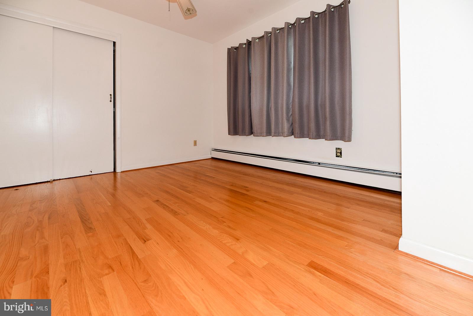 40480 Parsons Mill Road Leonardtown, MD 20650 - Photo 24 of 48 a view of an empty room with wooden floor
