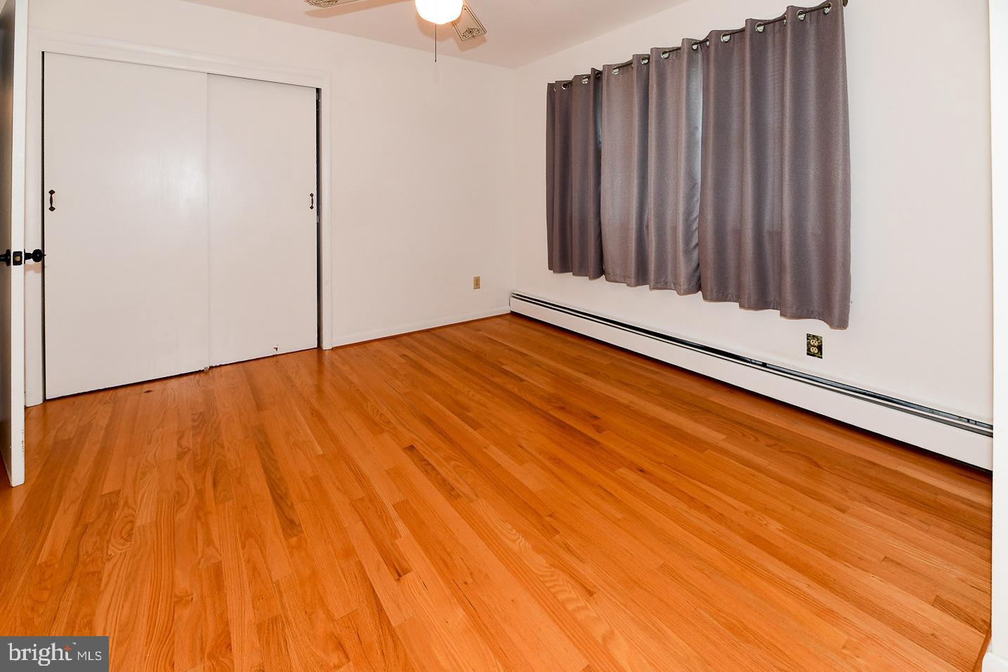 40480 Parsons Mill Road Leonardtown, MD 20650 - Photo 25 of 48 a view of an empty room with wooden floor