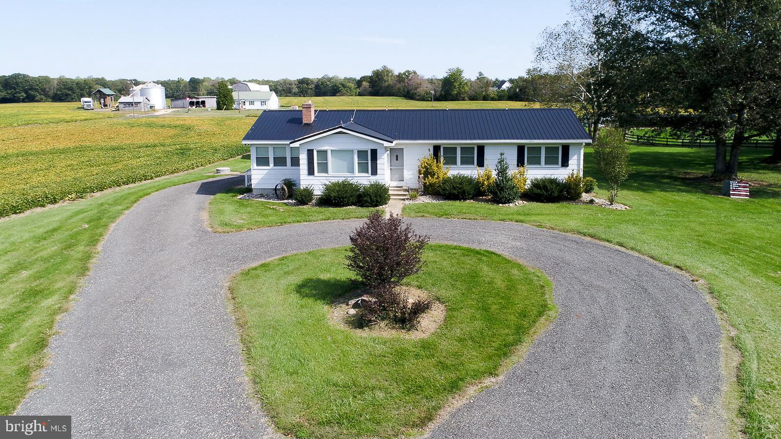 40480 Parsons Mill Road Leonardtown, MD 20650 - Photo 33 of 48 a front view of a house with a yard table and chairs