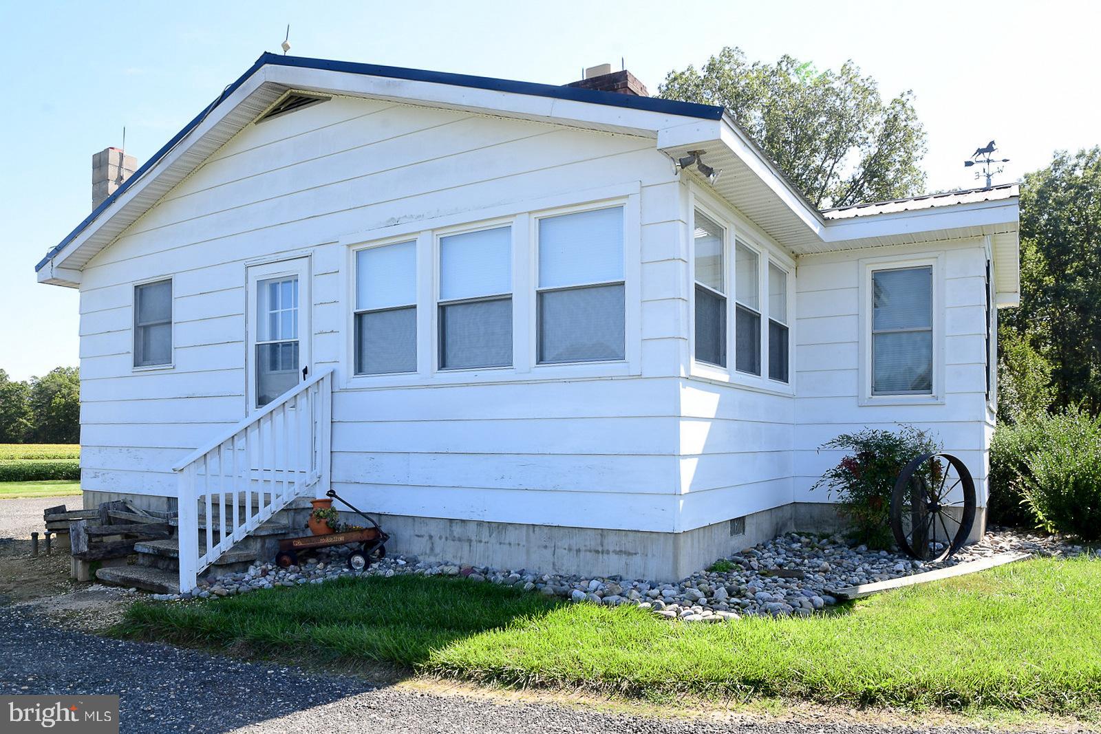40480 Parsons Mill Road Leonardtown, MD 20650 - Photo 40 of 48 a view of a house with a yard plants and large tree