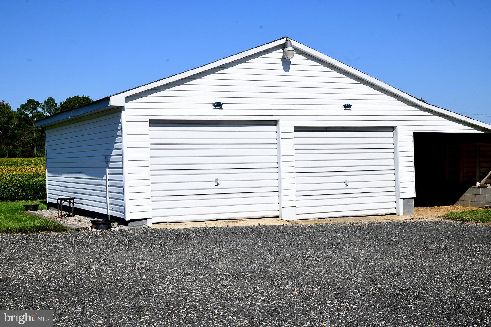 40480 Parsons Mill Road Leonardtown, MD 20650 - Photo 44 of 48 a view of a white house next to a yard