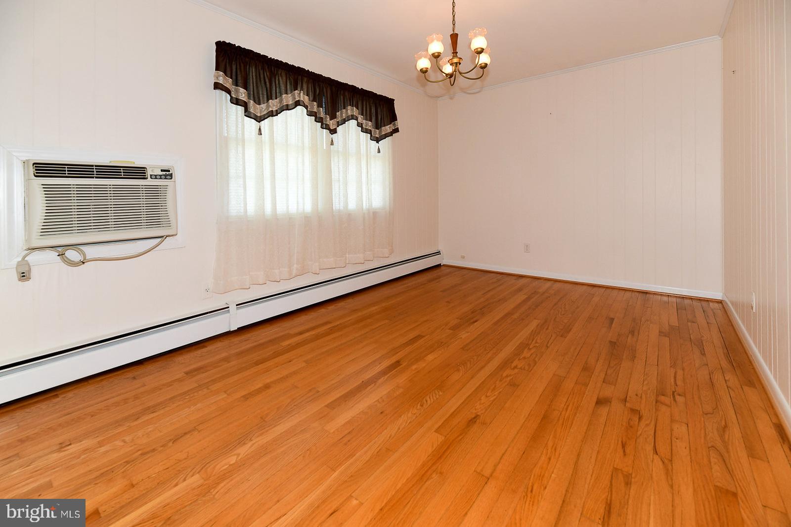 40480 Parsons Mill Road Leonardtown, MD 20650 - Photo 8 of 48 a view of empty room with wooden floor and fan