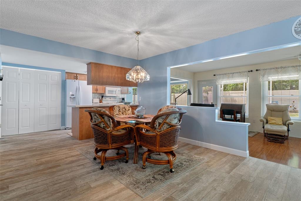 2643 Royal Ridge Drive Spring Hill, FL 34606 - Photo 13 of 84 a view of a dining room with furniture and wooden floor