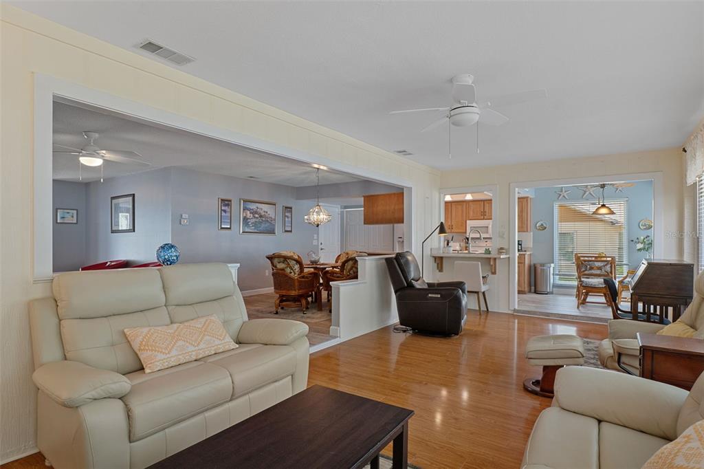 2643 Royal Ridge Drive Spring Hill, FL 34606 - Photo 22 of 84 a living room with furniture or couch and a view of kitchen