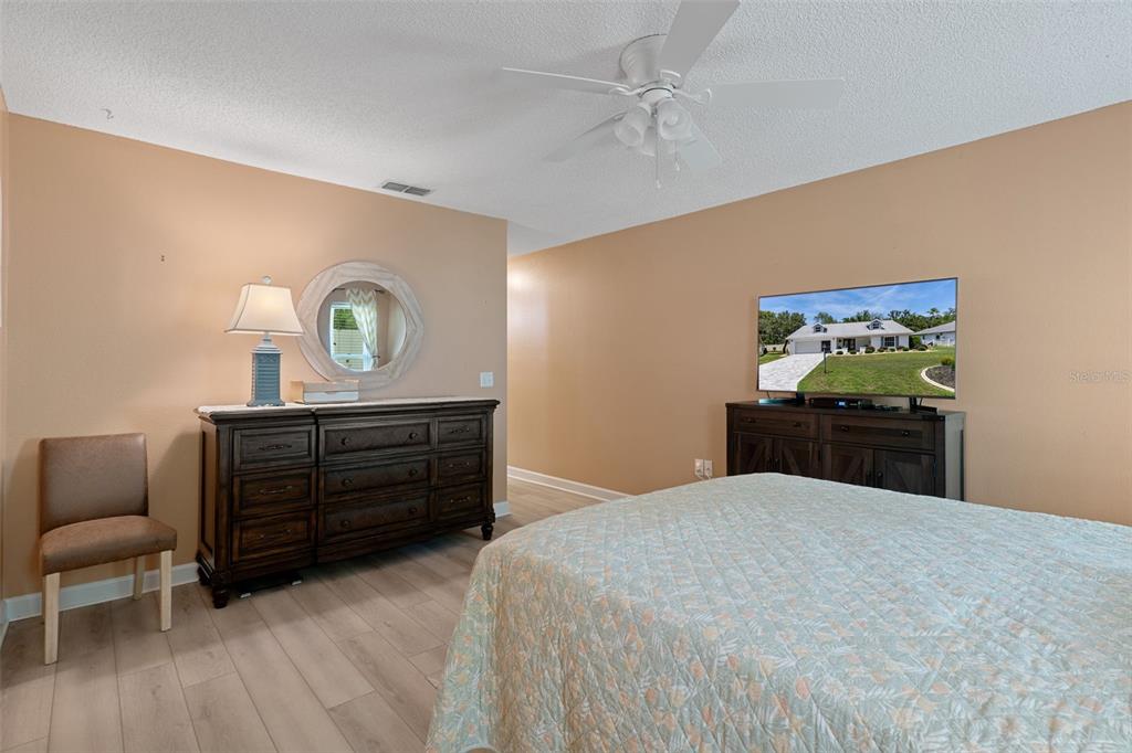 2643 Royal Ridge Drive Spring Hill, FL 34606 - Photo 24 of 84 a bed room with a bed and a dresser