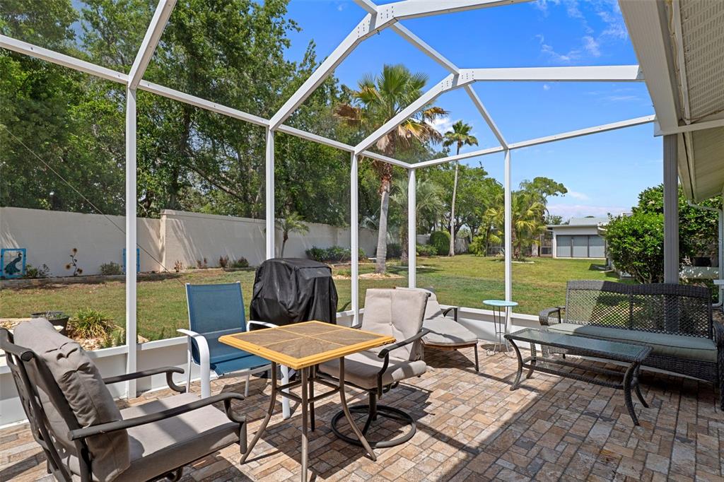 2643 Royal Ridge Drive Spring Hill, FL 34606 - Photo 34 of 84 a view of a patio with a table chairs and a backyard