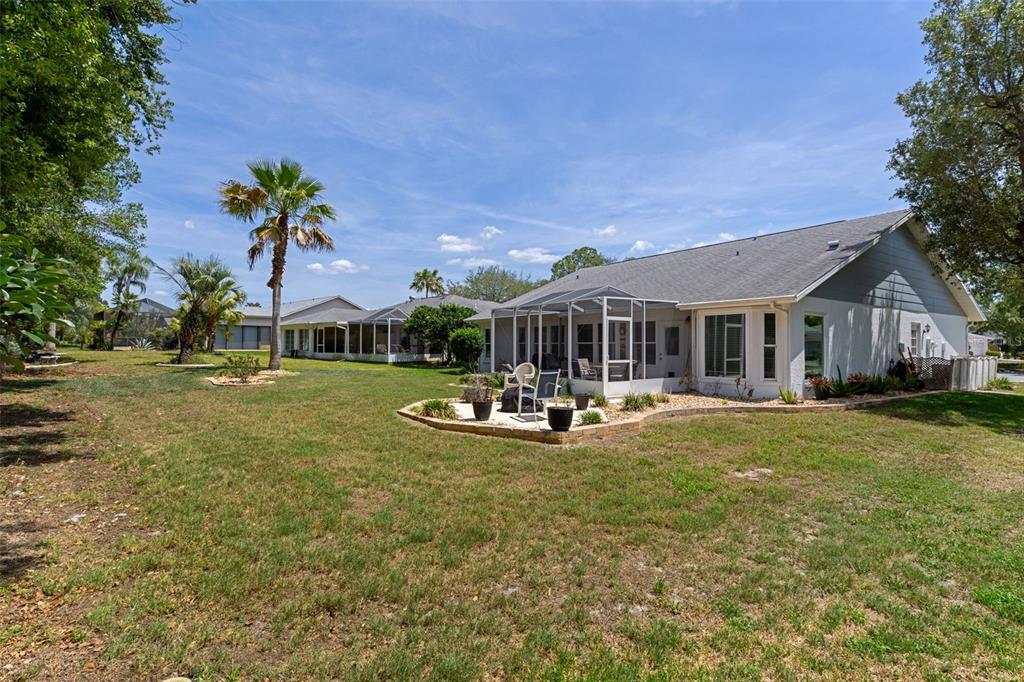 2643 Royal Ridge Drive Spring Hill, FL 34606 - Photo 37 of 84 a view of a house with backyard porch and sitting area