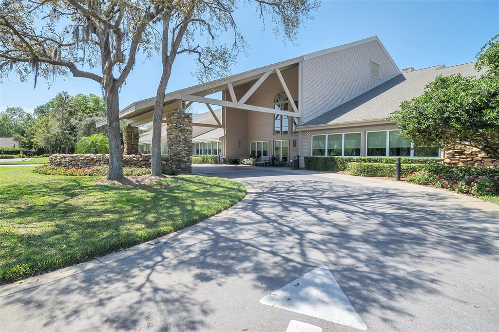 2643 Royal Ridge Drive Spring Hill, FL 34606 - Photo 54 of 84 a front view of a house with a yard and plants