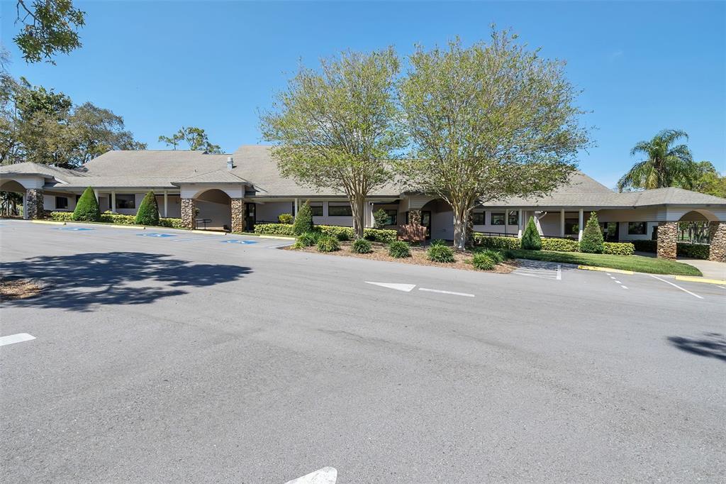 2643 Royal Ridge Drive Spring Hill, FL 34606 - Photo 64 of 84 a front view of a house with a yard and potted plants