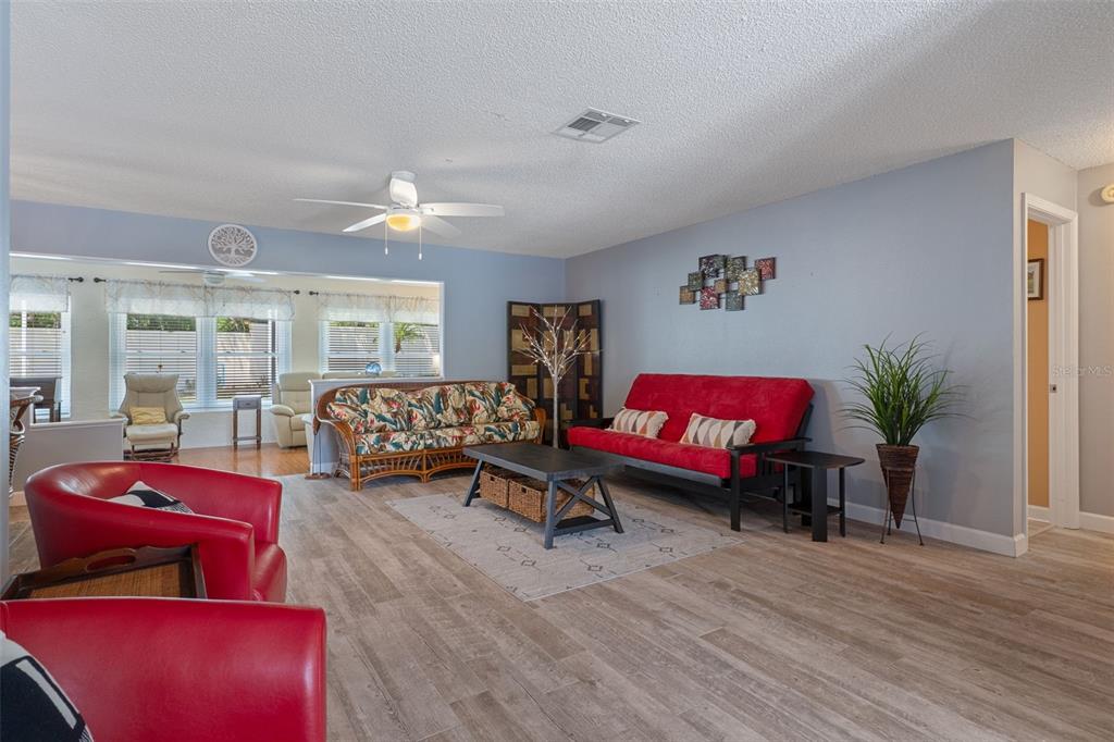 2643 Royal Ridge Drive Spring Hill, FL 34606 - Photo 8 of 84 a living room with furniture and wooden floor