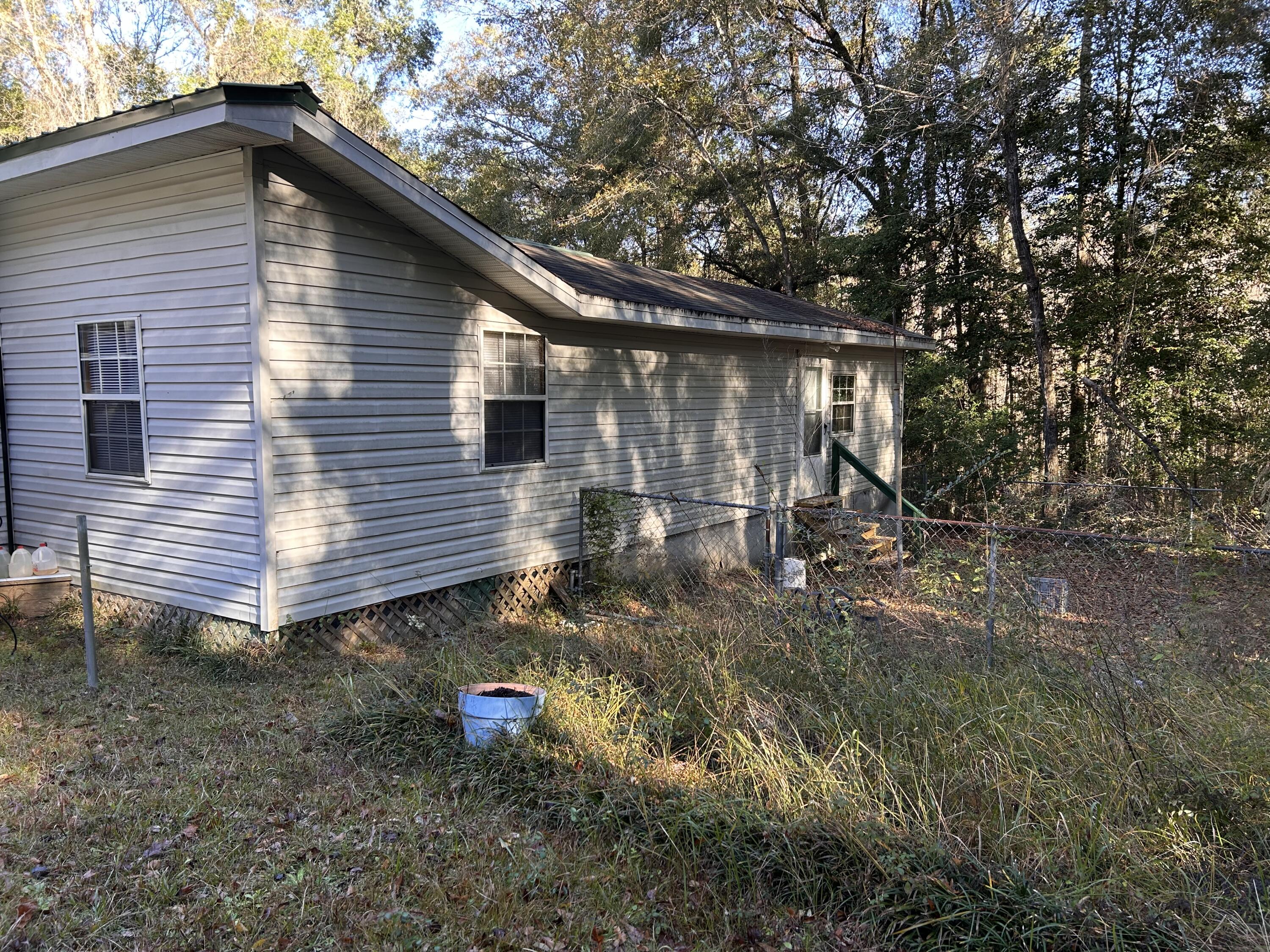 6853 Preston Posey Road Baker, FL 32531 - Photo 11 of 12 a view of backyard of house