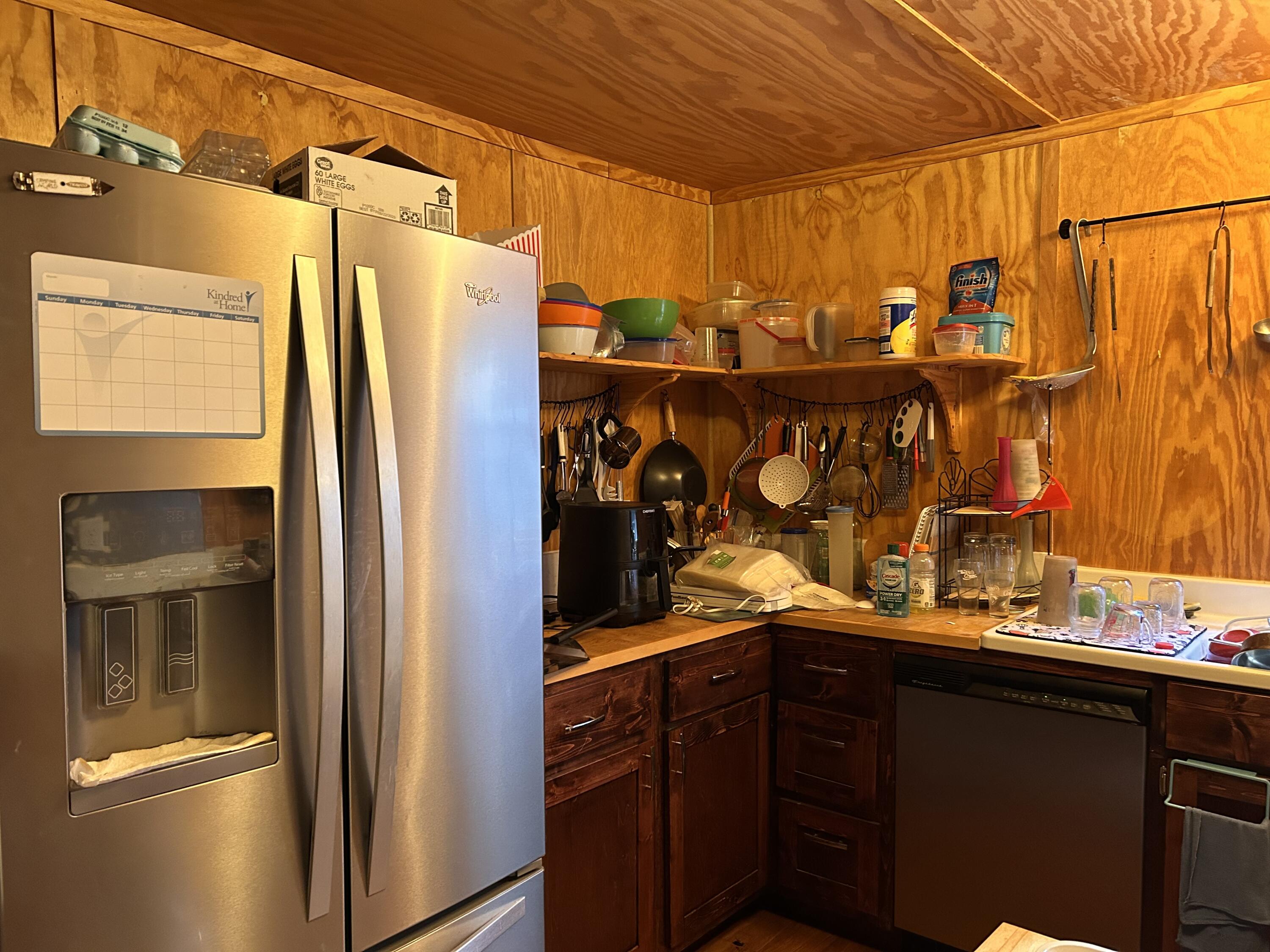 6853 Preston Posey Road Baker, FL 32531 - Photo 6 of 12 a kitchen with stainless steel appliances granite countertop a refrigerator and a sink
