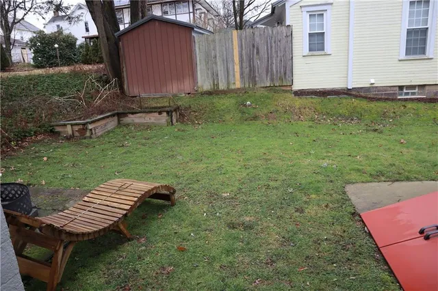 a view of a backyard with sitting area