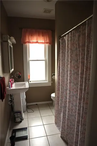 a bathroom with a bathtub a sink and a shower