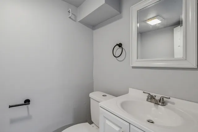 a view of an empty room with a bathroom