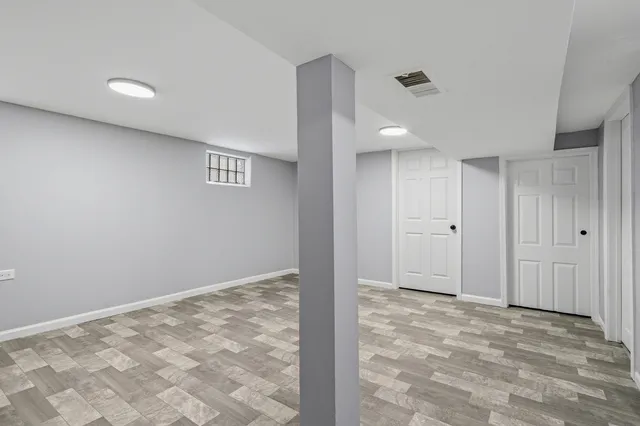 a view of a barn in the middle of a yard