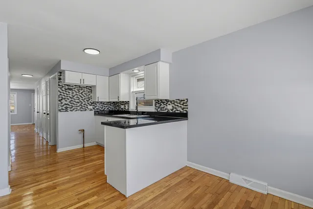 a kitchen with a sink and cabinets