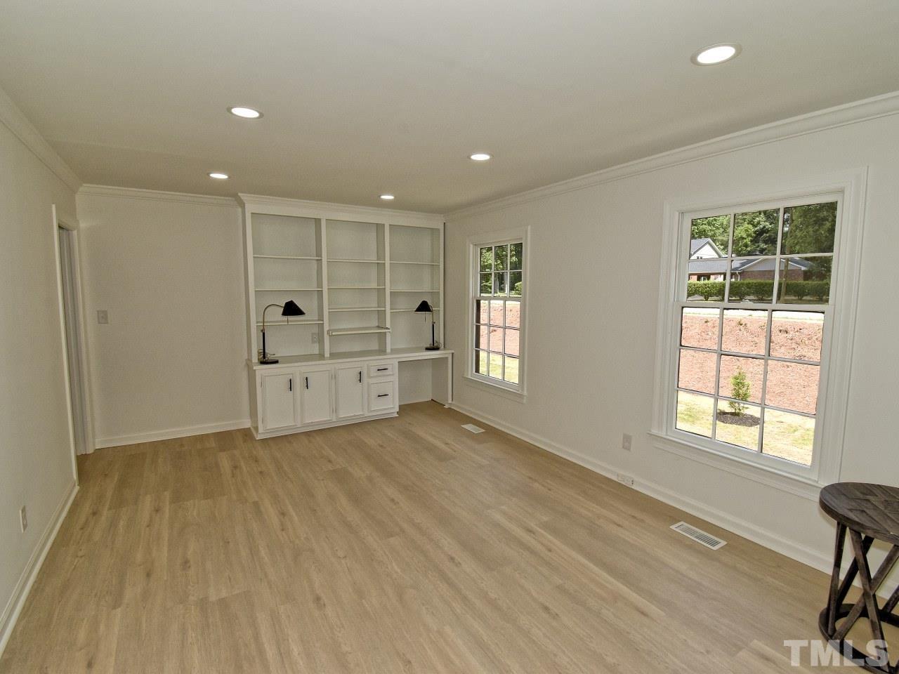 6530 Jean Drive Raleigh, NC 27612 - Photo 12 of 32 a view of room with window and wooden floor