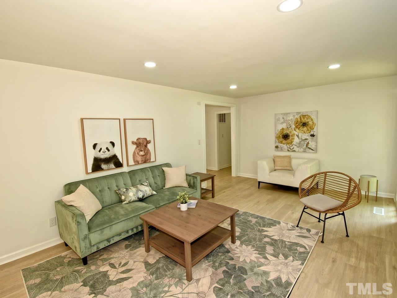 6530 Jean Drive Raleigh, NC 27612 - Photo 15 of 32 a living room with furniture and wooden floor
