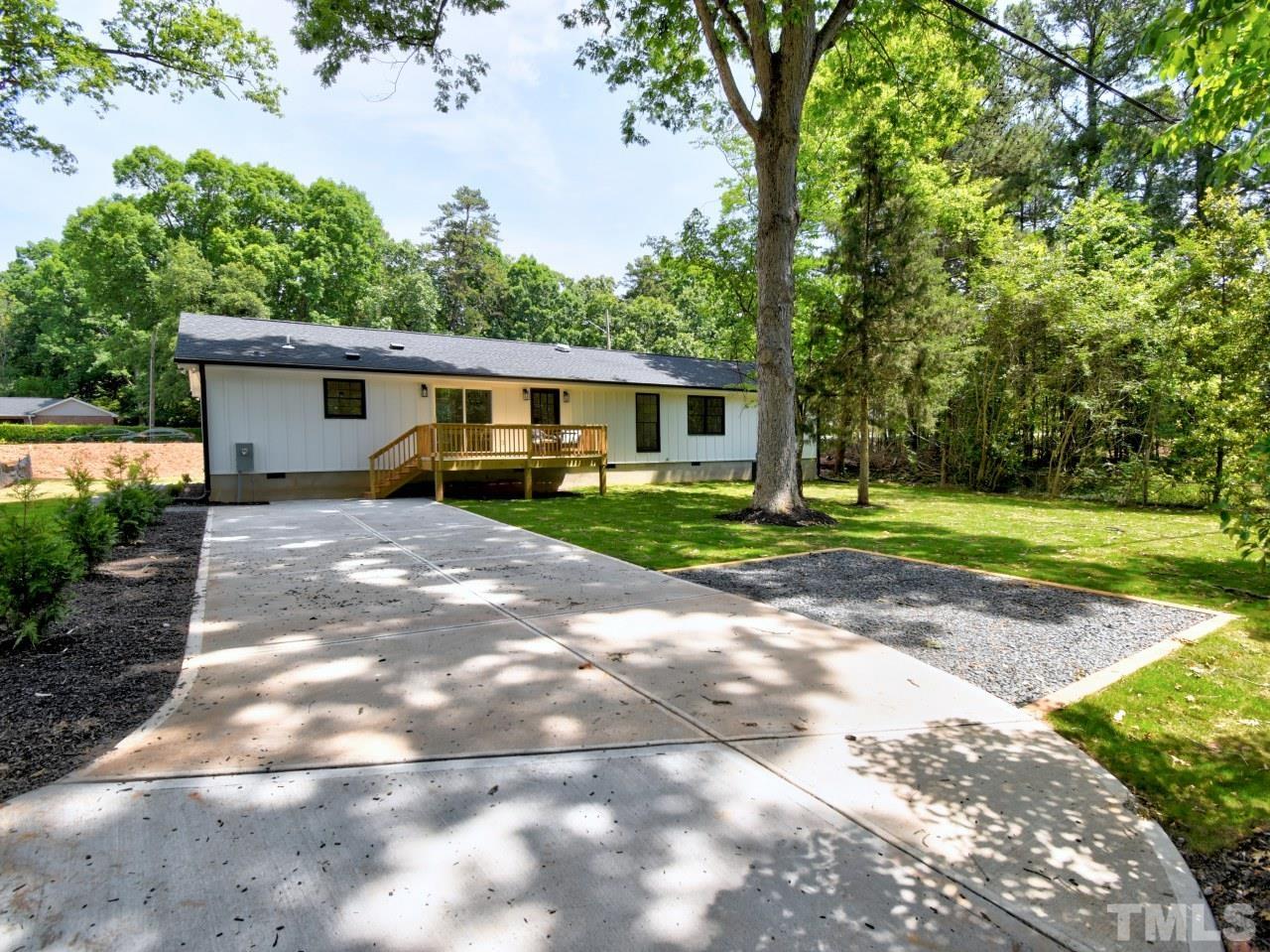 6530 Jean Drive Raleigh, NC 27612 - Photo 29 of 32 a view of a house with yard and a garden