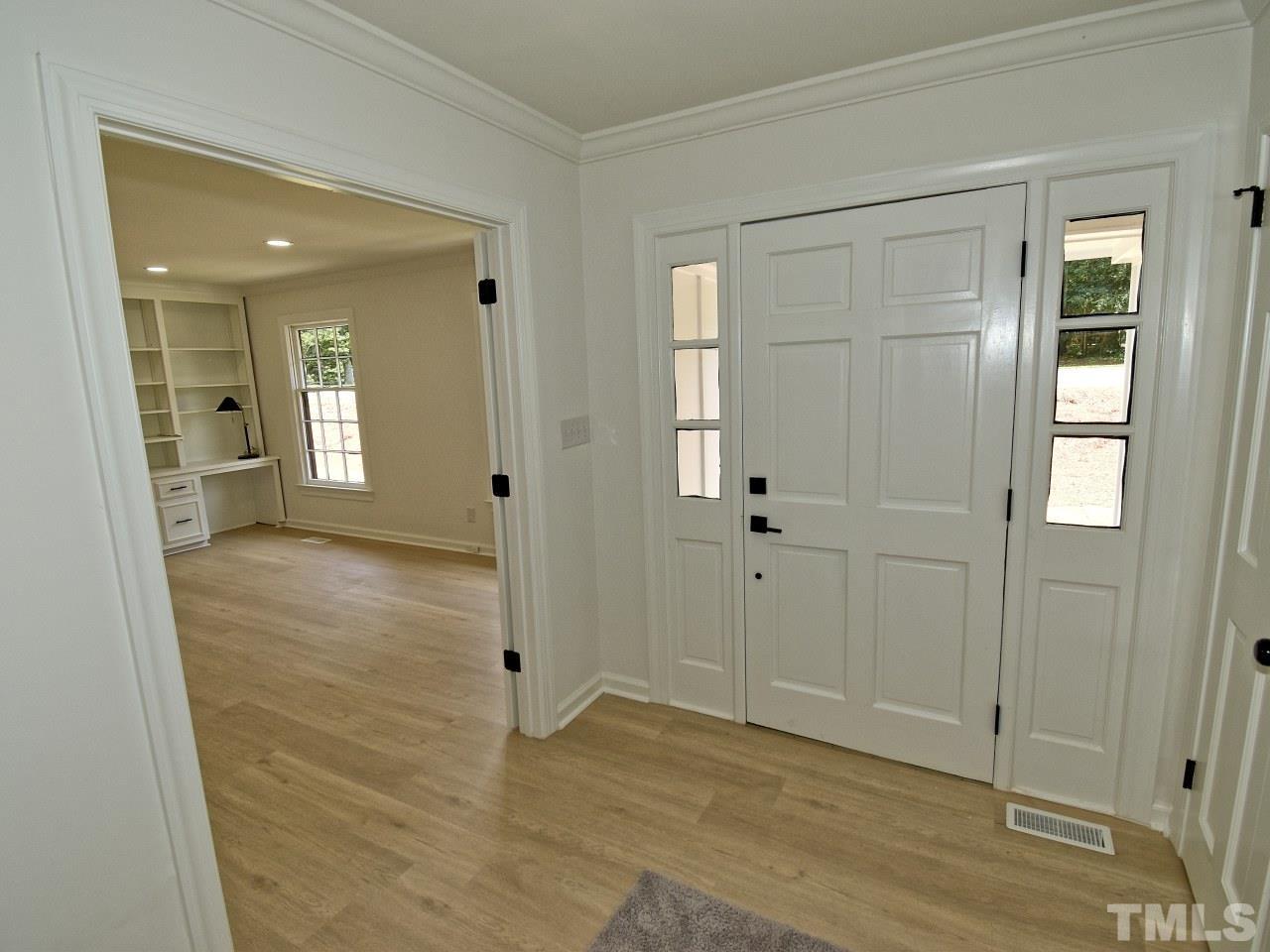 6530 Jean Drive Raleigh, NC 27612 - Photo 3 of 32 wooden floor with white walls