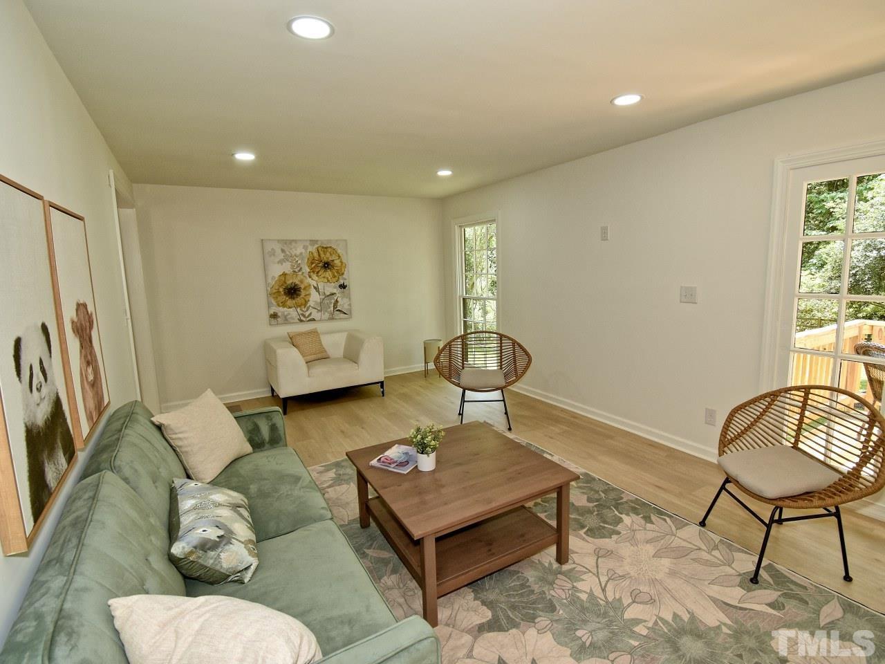 6530 Jean Drive Raleigh, NC 27612 - Photo 5 of 32 a living room with furniture and a window