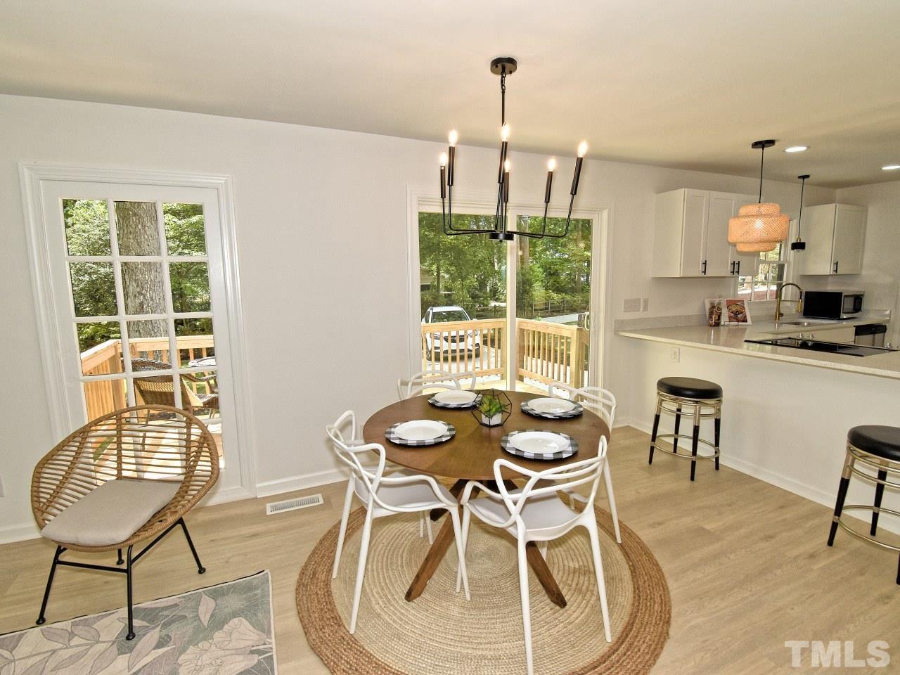 6530 Jean Drive Raleigh, NC 27612 - Photo 6 of 32 a dining room with furniture and window