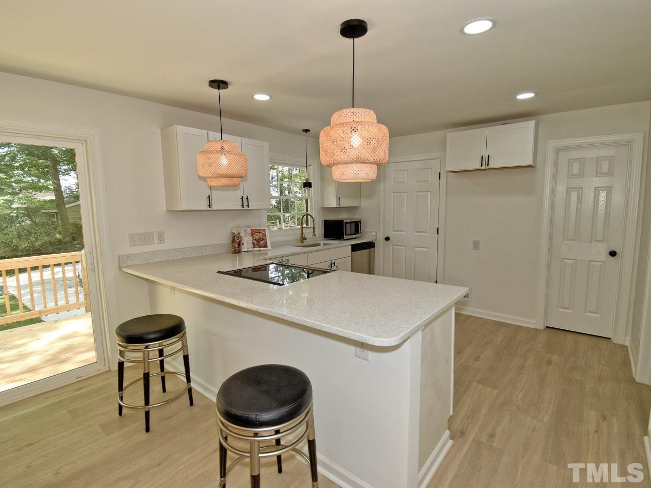 6530 Jean Drive Raleigh, NC 27612 - Photo 10 of 32 a kitchen with a sink a counter space and a window