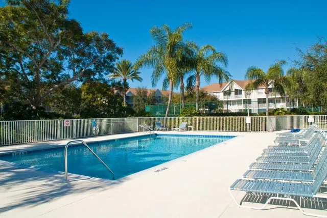 a view of swimming pool with outdoor seating and yard
