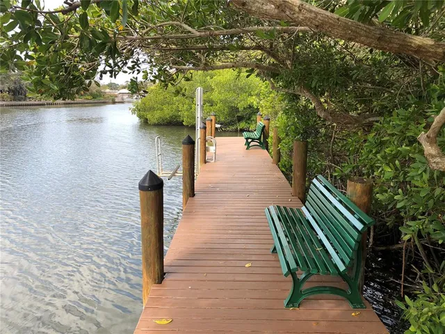 a view of a lake with sitting area