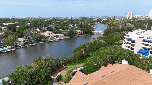 an aerial view of a city with ocean view