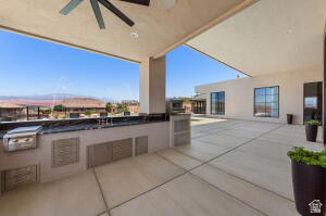 1141 East Lost Ridge Drive Washington, UT 84780 - Photo 4 of 108 Expansive outdoor patio featuring an integrated outdoor kitchen with grill, a ceiling fan, and a large open-air section
