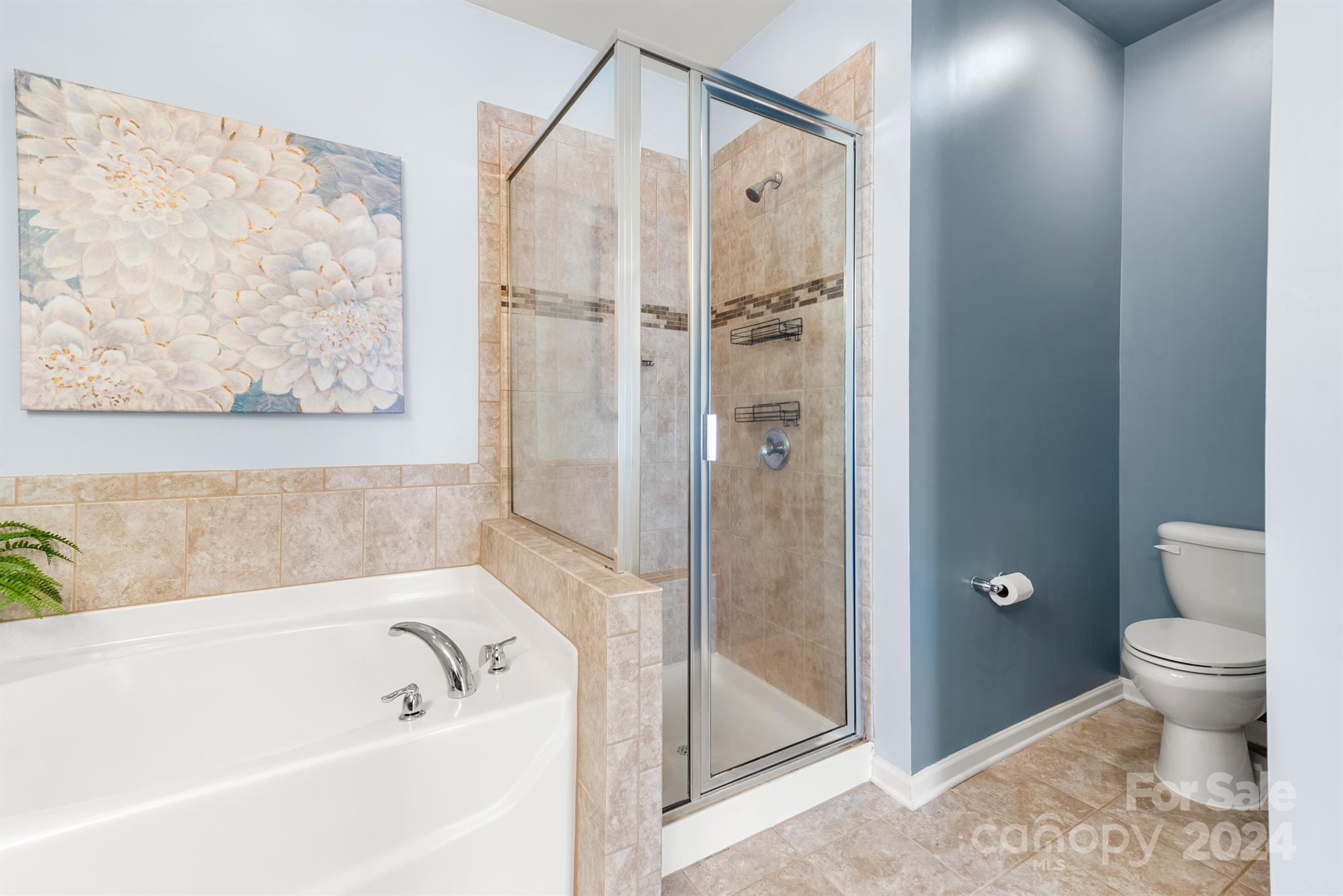 1555 Spring Blossom Trail Fort Mill, SC 29708 - Photo 23 of 47 a bathroom with a bathtub and a shower