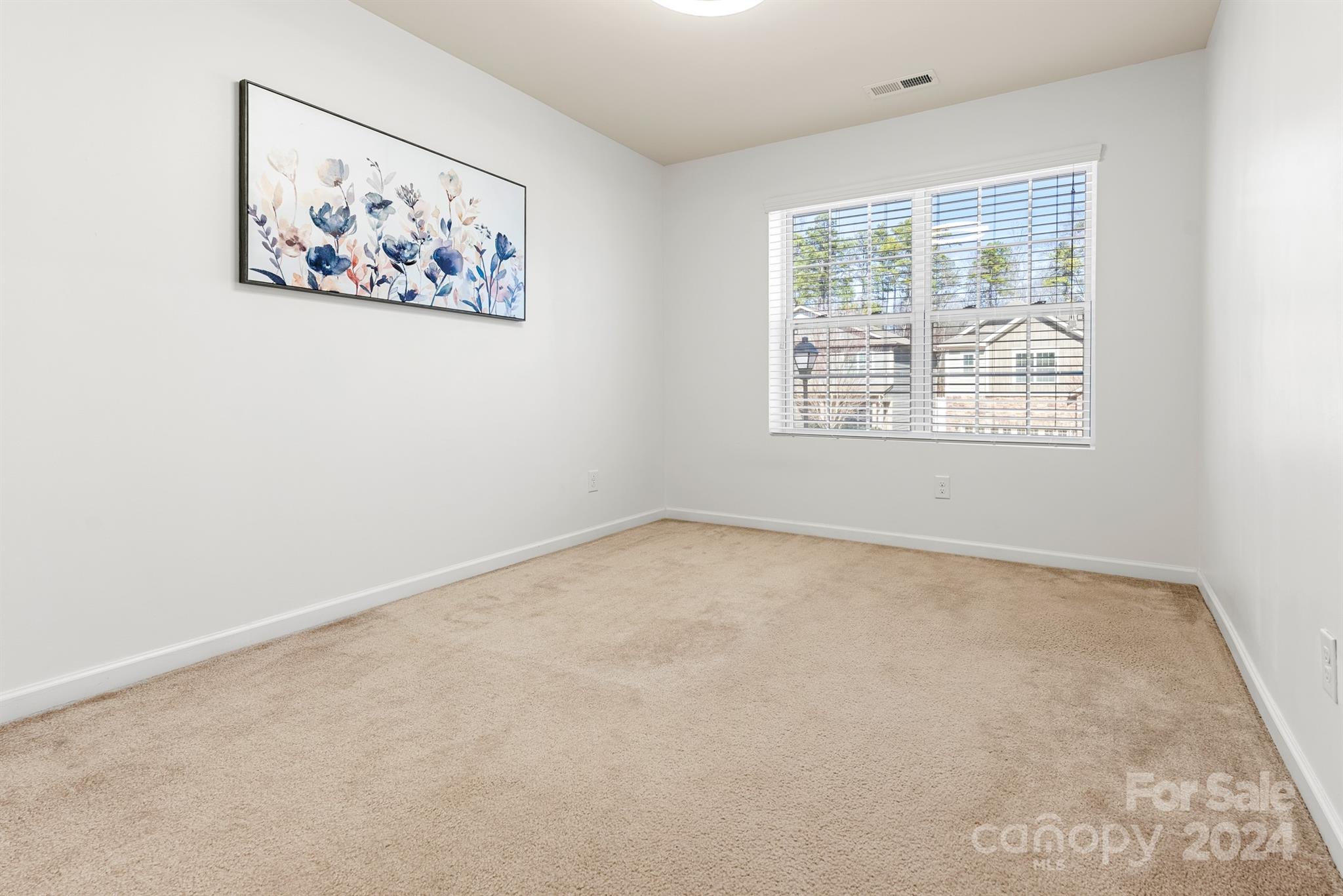 1555 Spring Blossom Trail Fort Mill, SC 29708 - Photo 31 of 47 an empty room with a window