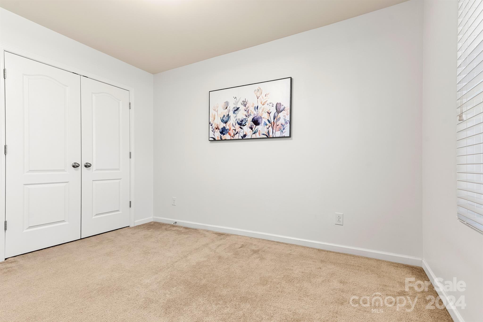 1555 Spring Blossom Trail Fort Mill, SC 29708 - Photo 32 of 47 an empty room with a hallway