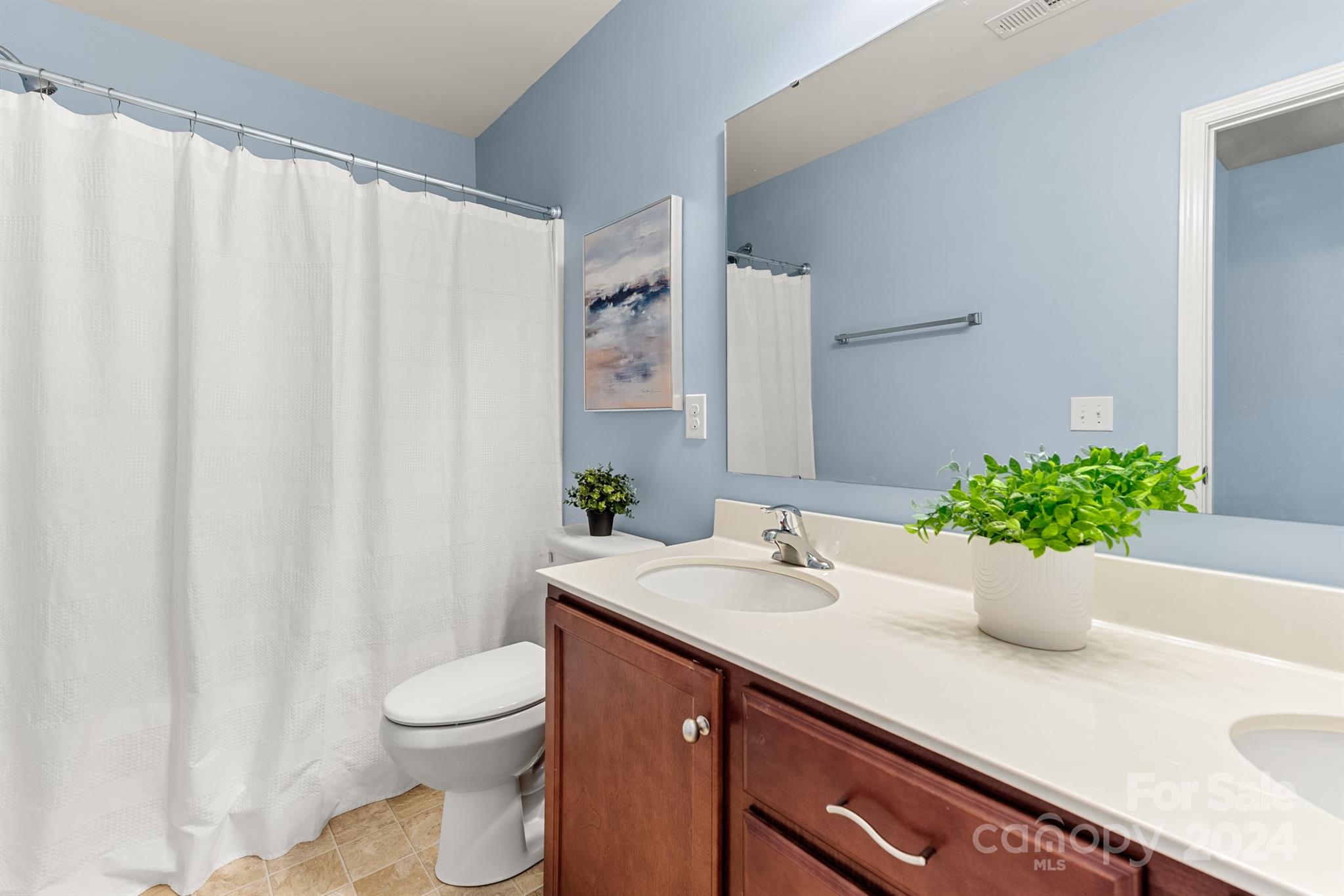1555 Spring Blossom Trail Fort Mill, SC 29708 - Photo 36 of 47 a bathroom with a sink a toilet and a mirror