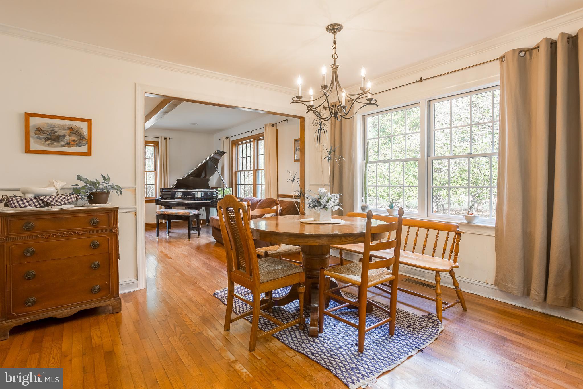 7904 Clark Road Denton, MD 21629 - Photo 21 of 71 a view of a dining room with furniture window and wooden floor