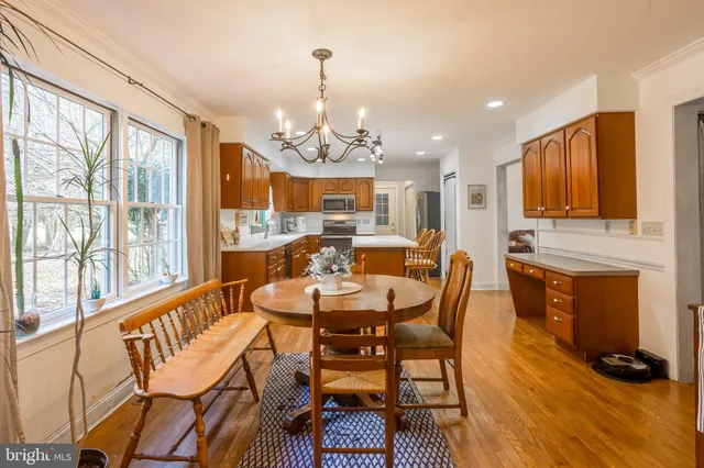 a room with lots of furniture and wooden floor