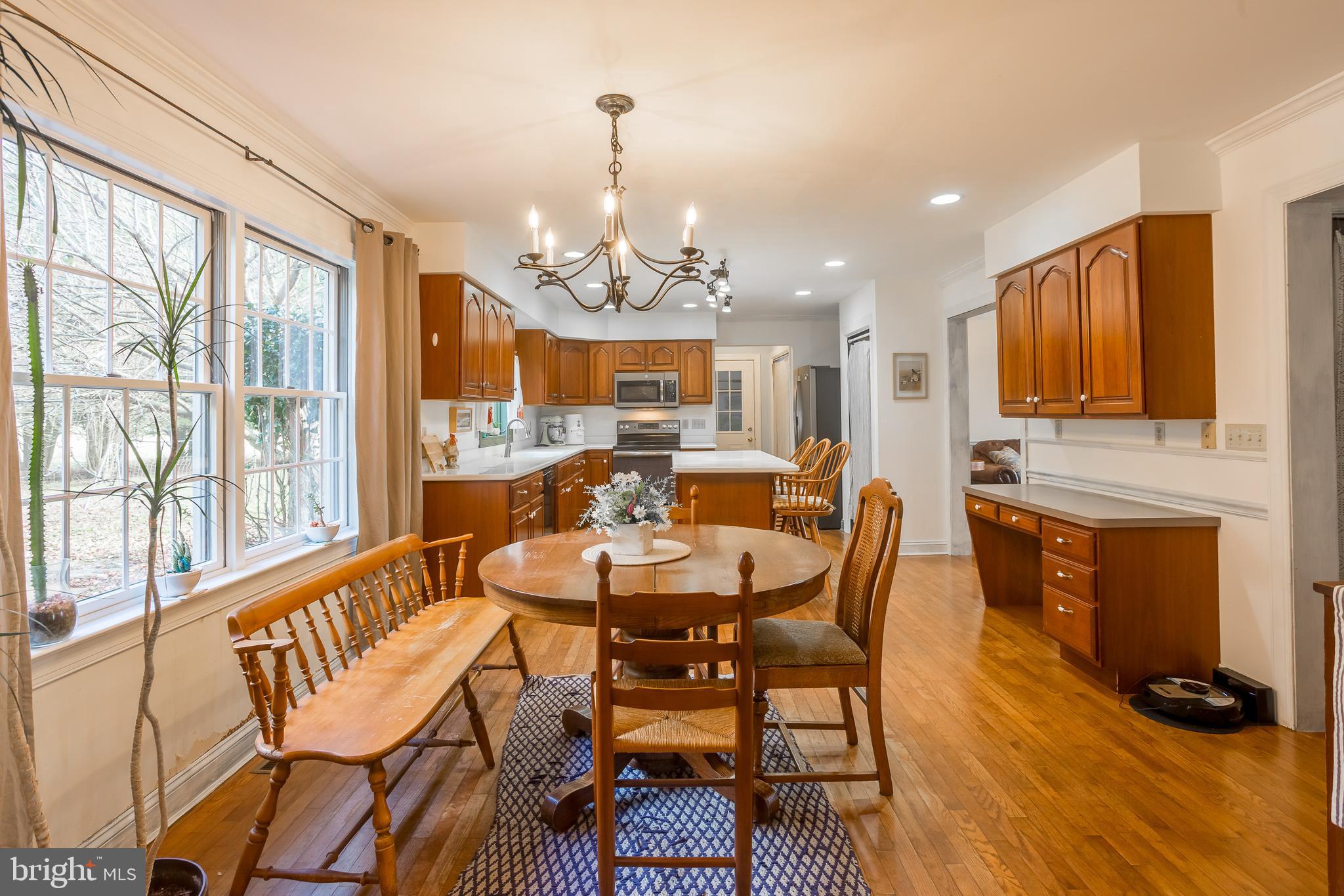 7904 Clark Road Denton, MD 21629 - Photo 23 of 71 a view of a dining room with furniture window and wooden floor
