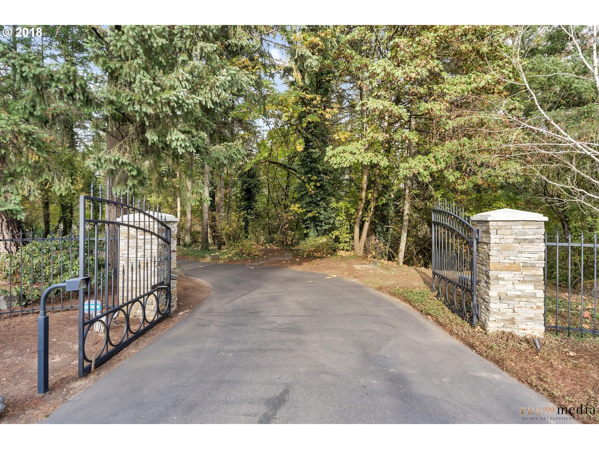 15096 South Springwater Road Oregon City, OR 97045 - Photo 3 of 31 a view of a pathway with a wrought fence