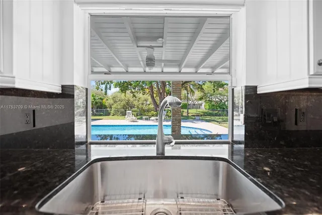 a view of a sink and a microwave oven