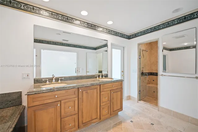 a bathroom with a double vanity sink mirror and double