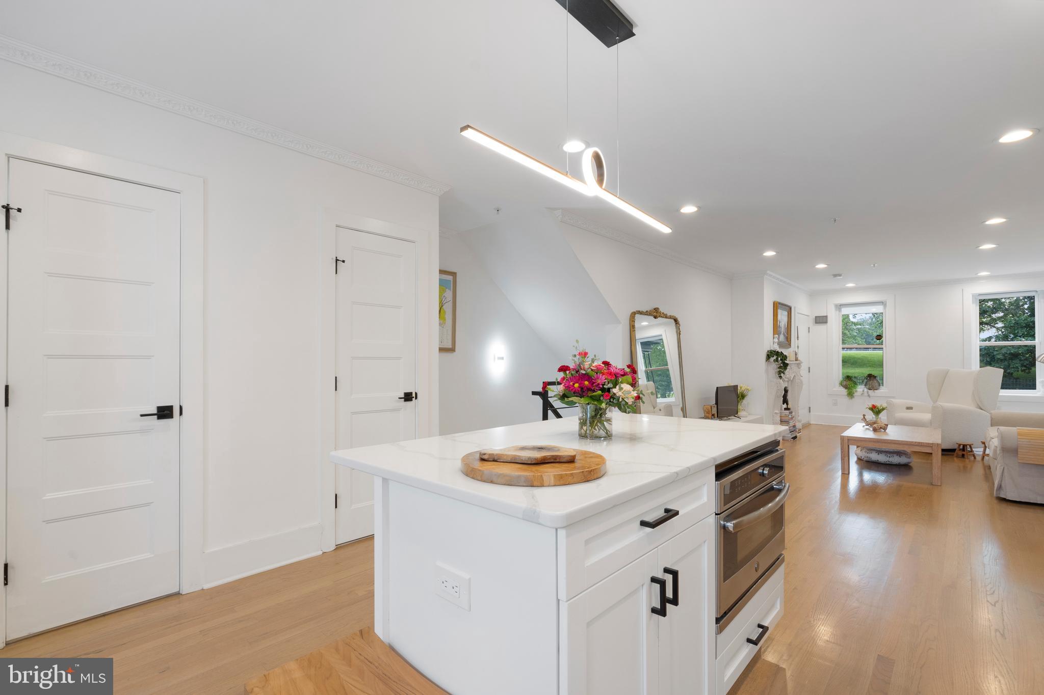 1427 West Virginia Avenue Northeast, Unit 1 Washington, DC 20002 - Photo 11 of 46 a kitchen with sink cabinets and wooden floor