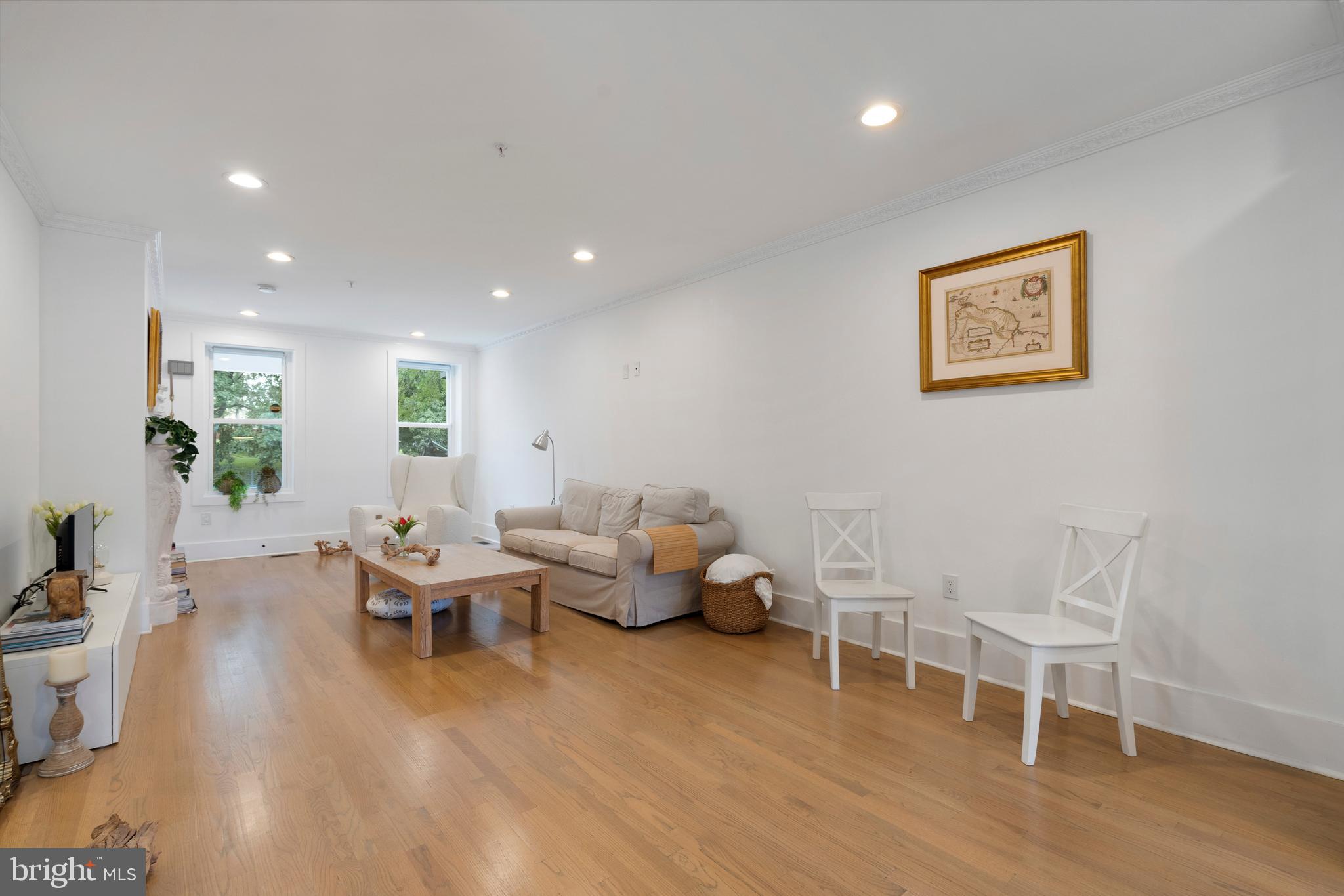 1427 West Virginia Avenue Northeast, Unit 1 Washington, DC 20002 - Photo 15 of 46 a living room with furniture and wooden floor