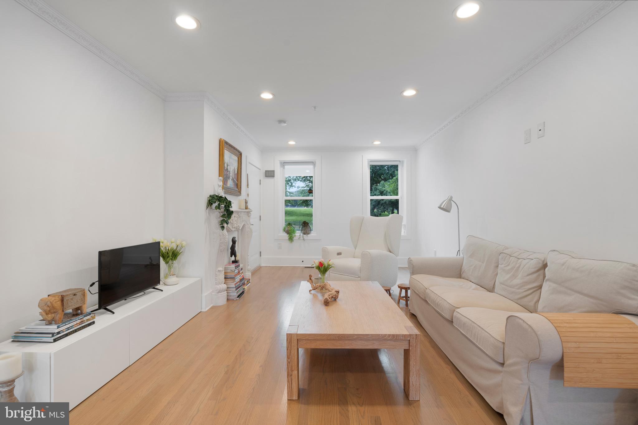 1427 West Virginia Avenue Northeast, Unit 1 Washington, DC 20002 - Photo 18 of 46 a living room with furniture and a flat screen tv