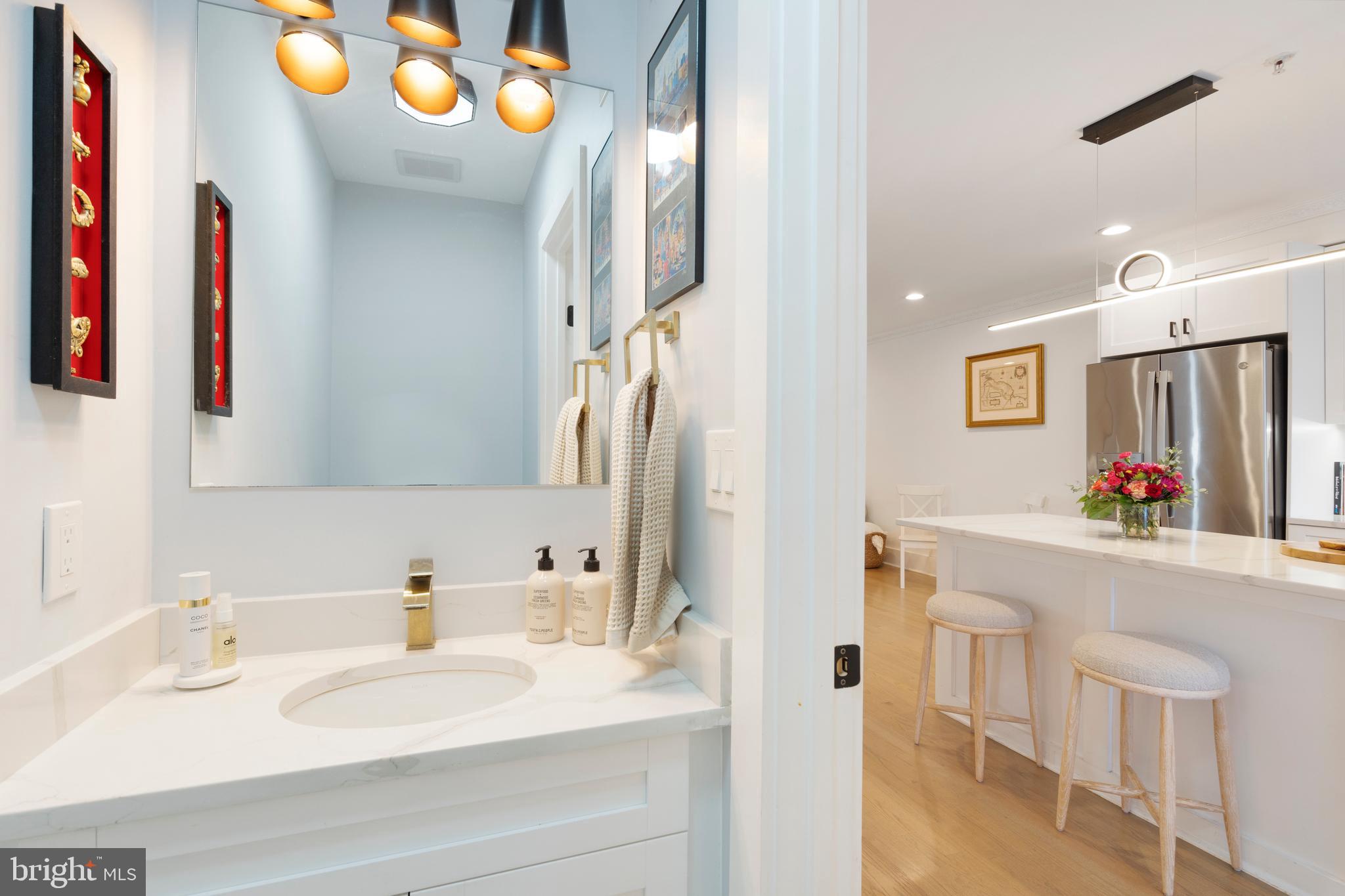 1427 West Virginia Avenue Northeast, Unit 1 Washington, DC 20002 - Photo 20 of 46 a bathroom with a sink mirror and vanity